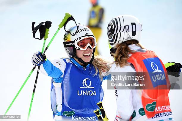 Andrea Limbacher of Austria celebrates winning gold with silver medalist Ophelie David of France in the Big Final of the Women's Ski Cross Finals...