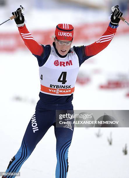 Russia's Yulia Tchekaleva reacts as she wins the women's skiathlon 7.5 km classic + 7.5 km free race of the FIS Cross-country World Cup event on...