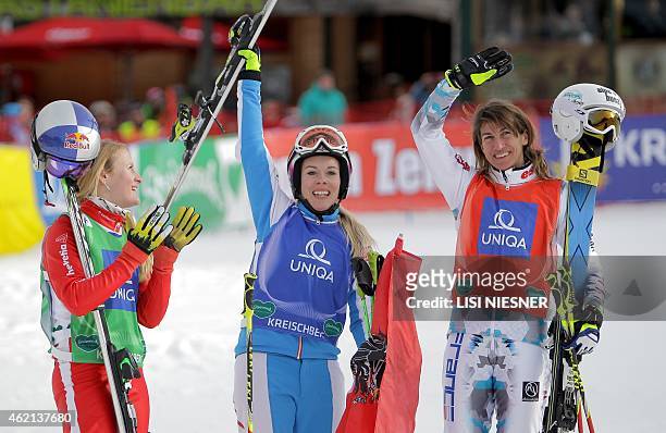 First placed Austria's Andrea Limbacher, second placed France's Ophelie David and third placed Switzerland's Fanny Smith celebrate after the Women's...