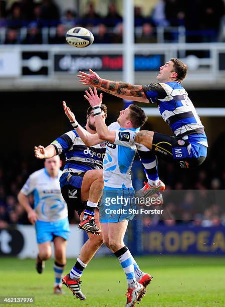 Bath wing Matt Banahan outjumps Finn Russell of Glasgow during the European Rugby Champions Cup match between Bath Rugby and Glasgow Warriors at...