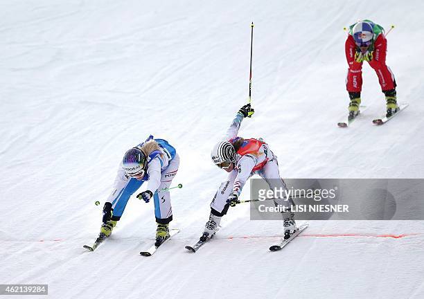 First placed Austria's Andrea Limbacher , second placed France's Ophelie David and third placed Switzerland's Fanny Smith cross the finish line...