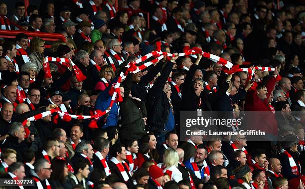 Bristol City fans tie their scarves together as they show their suport during the FA Cup Fourth Round match between Bristol City and West Ham United...