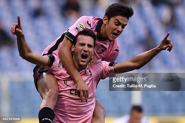 Franco Vazquez of Palermo celebrates with Paulo Dybala after scoring the equalizing goal during the Serie A match between UC Sampdoria and US Citta...