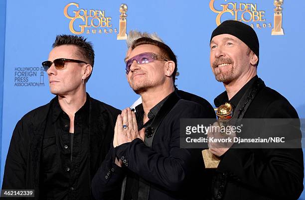 71st ANNUAL GOLDEN GLOBE AWARDS -- Pictured: Musicians Larry Mullen Jr., Adam Clayton, Bono, and The Edge of U2 pose with their award for Best...