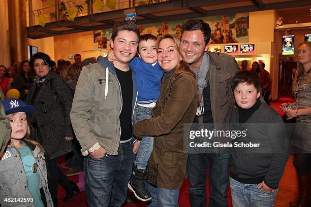 Julia Dahmen with husband Carlo, son Joshua, Emilio and Mikosch attend the premiere of the film 'Fuenf Freunde 3' at Cinemaxx on January 12, 2014 in...