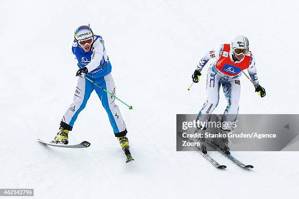 Ophelie David of France takes 2nd place, Andrea Limbacher of Austria takes 1st place during the FIS Freestyle Ski World Championships Men's and...