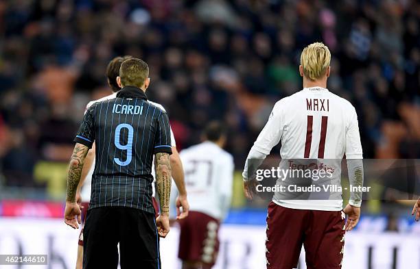 Mauro Icardi of FC Internazionale and Maxi Lopez of Torino FC during the Serie A match between FC Internazionale Milano and Torino FC at Stadio...
