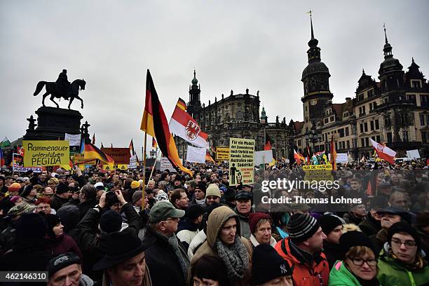 Supporters of the Pegida movement rally during their weekly demonstration on January 25, 2015 in Dresden. Pegida is an acronym for 'Patriotische...