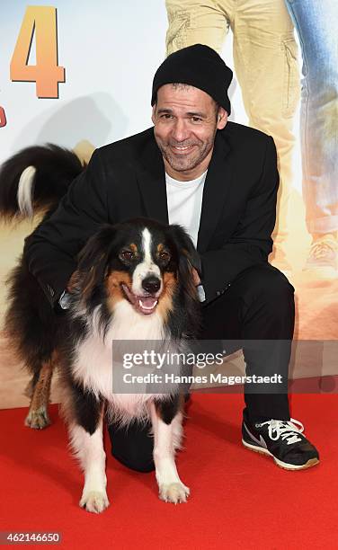 Mike Marzuk and the dog Timmy attends the premiere of the film 'Fuenf Freunde 4' at Cinemaxx on January 25, 2015 in Munich, Germany.