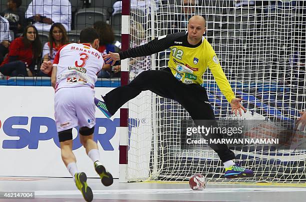 Macedonia's Filip Mirkulovski scores during the 24th Men's Handball World Championships Eighth Final EF1 match between Slovenia and Macedonia at the...