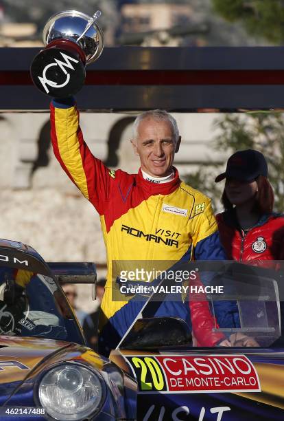 French driver Francois Delecour celebrates, on January 25, 2015 in Monaco, during the podium ceremony, after their victory in the 83nd Monte-Carlo...