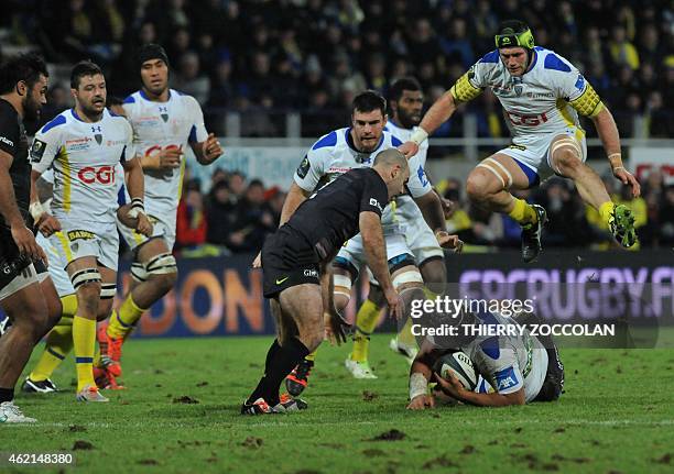 Clermont's French flanker Julien Bonnaire jumps over Clermont's New Zealander flanker Fritz Lee during the European Champions Cup rugby union match...