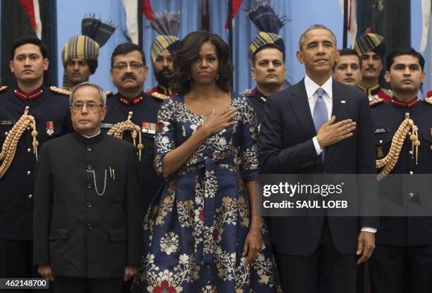 Indian President Pranab Mukherjee stands for the American National Anthem alongside US President Barack Obama and First Lady Michelle Obama prior to...