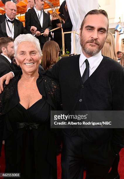 71st ANNUAL GOLDEN GLOBE AWARDS -- Pictured: Arlyn Phoenix and actor Joaquin Phoenix arrive to the 71st Annual Golden Globe Awards held at the...