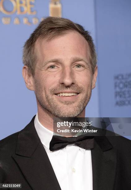 Screenwriter Spike Jonze, winner of the Best Screenplay Award for "Her" poses in the press room during the 71st Annual Golden Globe Awards held at...