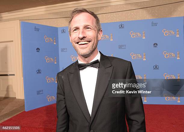 Screenwriter Spike Jonze, winner of the Best Screenplay Award for "Her" poses in the press room during the 71st Annual Golden Globe Awards held at...