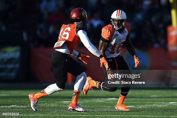 Sammie Coates of the South team works against Josh Shaw of the North team during the Reese's Senior Bowl at Ladd Peebles Stadium on January 24, 2015...