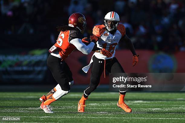 Sammie Coates of the South team works against Josh Shaw of the North team during the Reese's Senior Bowl at Ladd Peebles Stadium on January 24, 2015...