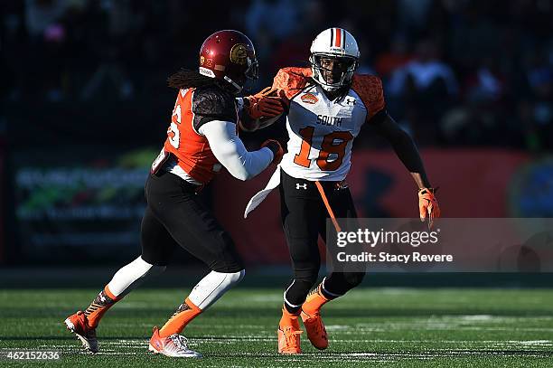 Sammie Coates of the South team works against Josh Shaw of the North team during the Reese's Senior Bowl at Ladd Peebles Stadium on January 24, 2015...