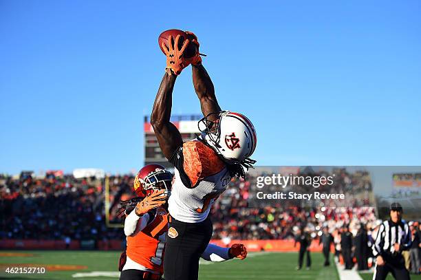 Sammie Coates of the South team catches a pass in front of Josh Shaw of the North team during the Reese's Senior Bowl at Ladd Peebles Stadium on...