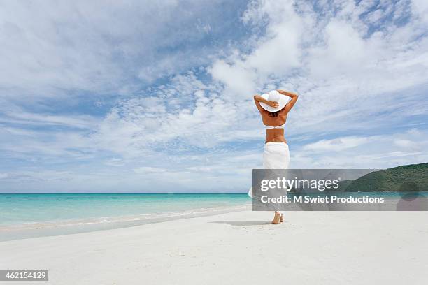 elegant beach walk - sarong stock pictures, royalty-free photos & images