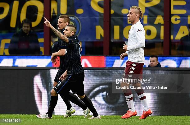 Mauro Icardi of FC Internazionale and Maxi Lopez of Torino FC during the Serie A match between FC Internazionale Milano and Torino FC at Stadio...