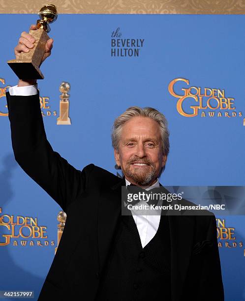 71st ANNUAL GOLDEN GLOBE AWARDS -- Pictured: Actor Michael Douglas poses with his award for Best Performance in a Miniseries or Television Film for...