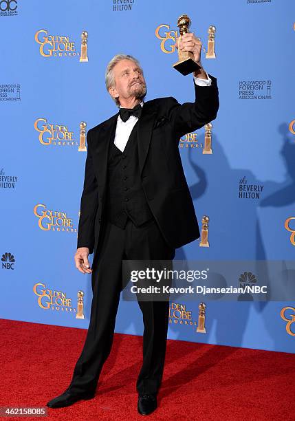 71st ANNUAL GOLDEN GLOBE AWARDS -- Pictured: Actor Michael Douglas poses with his award for Best Performance in a Miniseries or Television Film for...