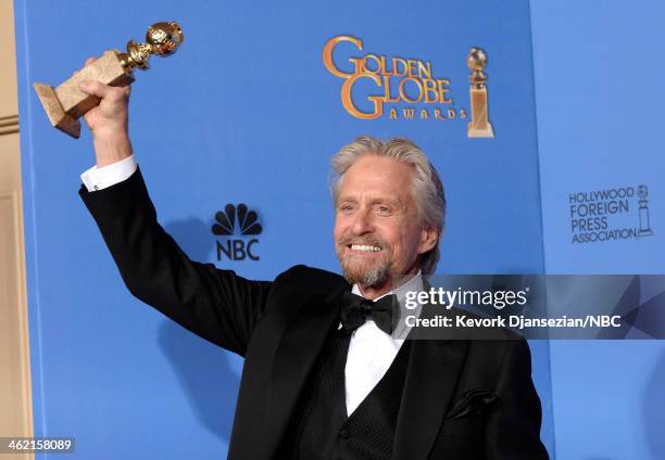 71st ANNUAL GOLDEN GLOBE AWARDS -- Pictured: Actor Michael Douglas poses with his award for Best Performance in a Miniseries or Television Film for...