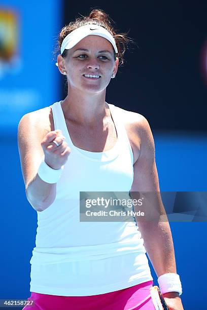 Casey Dellacqua of Australia celebrates winning her first round match against Vera Zvonareva of Russia during day one of the 2014 Australian Open at...