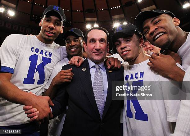 Head coach Mike Krzyzewski of the Duke Blue Devils celebrates with teamates after his 1000th career win after the game against the St. John's Red...