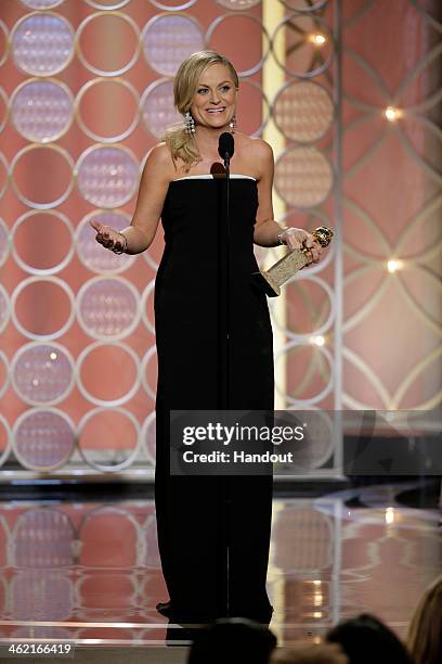 In this handout photo provided by NBCUniversal, Amy Poehler accepts the award for Best Actress - TV Series, Comedy or Musical for "Parks and...