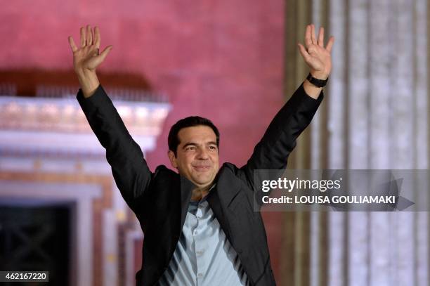 Syriza leader Alexis Tsipras greets supporters following victory in the election in Athens on January 25, 2015. Greek Prime Minister Antonis Samaras...