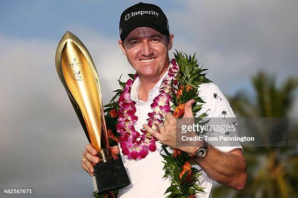 Jimmy Walker celebrates with the trophy after winning the the Sony Open in Hawaii at Waialae Country Club on January 12, 2014 in Honolulu, Hawaii.