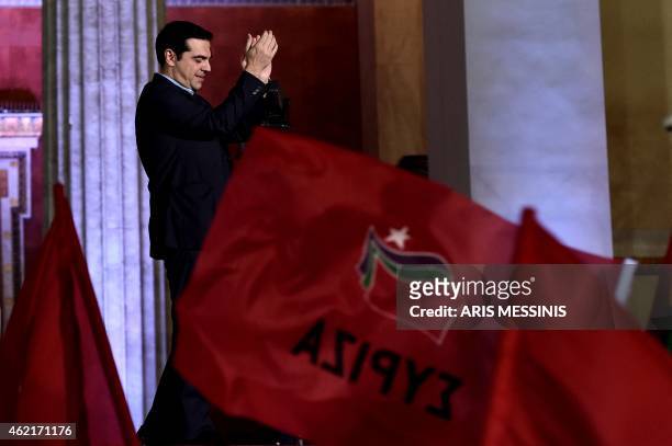 Syriza leader Alexis Tsipras greets supporters following victory in the election in Athens on January 25, 2015. The left-wing Syriza party led by...