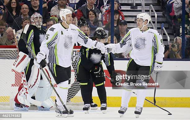 Ryan Getzlaf of the Anaheim Ducks and Team Toews and Vladimir Tarasenko of the St. Louis Blues and Team Toews celebrate against Team Foligno in the...