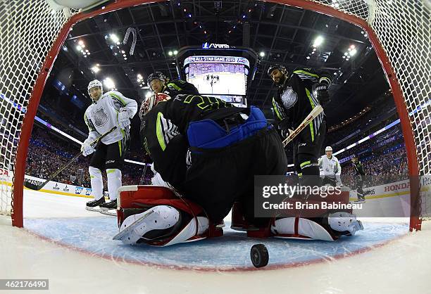 Patrice Bergeron of the Boston Bruins and Team Toews scores in the first period against goaltender Carey Price of the Montreal Canadiens and Team...