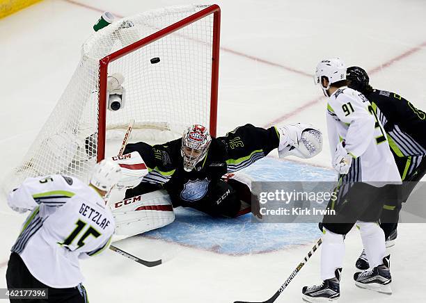 Ryan Getzlaf of the Anaheim Ducks and Team Toews scores against Carey Price of the Montreal Canadiens and Team Foligno in the first period during the...