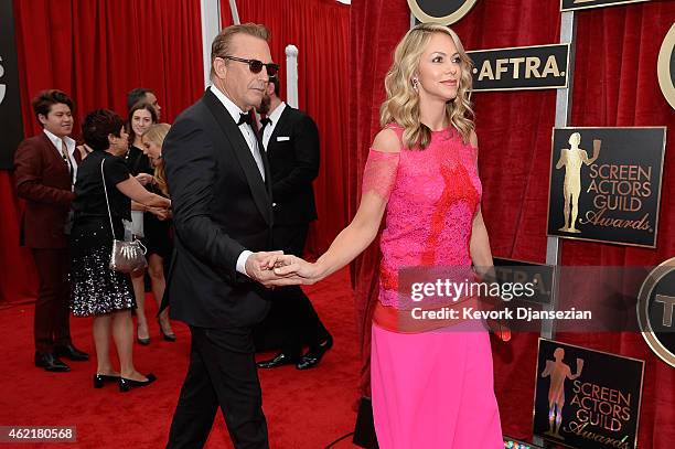 Actor Kevin Costner and wife Christine Baumgartner attend the 21st Annual Screen Actors Guild Awards at The Shrine Auditorium on January 25, 2015 in...