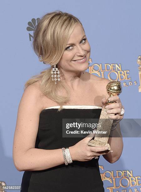 Actress Amy Poehler, winner of Best Actress in a Television Series - Musical or Comedy for 'Parks and Recreation,' poses in the press room during the...