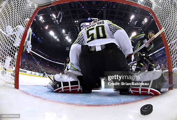 Nick Foligno of the Columbus Blue Jackets and Team Foligno scores against goaltender Corey Crawford of the Chicago Blackhawks and Team Toews in the...
