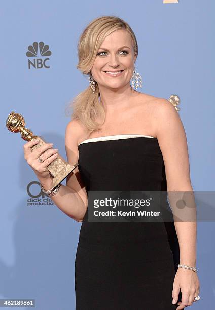 Actress Amy Poehler, winner of Best Actress in a Television Series - Musical or Comedy for 'Parks and Recreation,' poses in the press room during the...