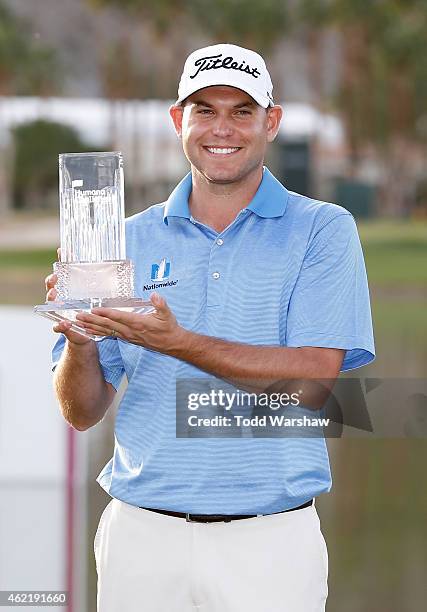 Bill Haas of the United States poses with the trophy after winning the final round of the Humana Challenge in partnership with The Clinton Foundation...