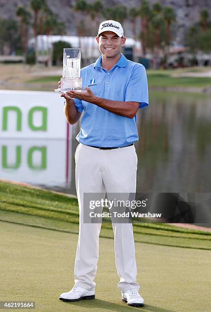 Bill Haas of the United States poses with the trophy after winning the final round of the Humana Challenge in partnership with The Clinton Foundation...