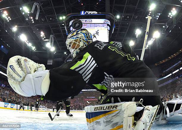 Goaltender Brian Elliott of the St. Louis Blues and Team Foligno can't make the save on a shot for a goal by Rick Nash of the New York Rangers and...