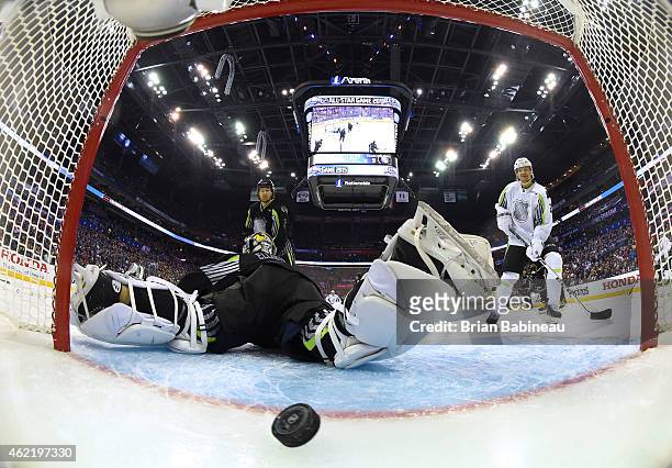 Duncan Keith of the Chicago Blackhawks and Team Foligno and Patrik Elias of the New Jersey Devils and Team Toews watch the puck bounce in the net...