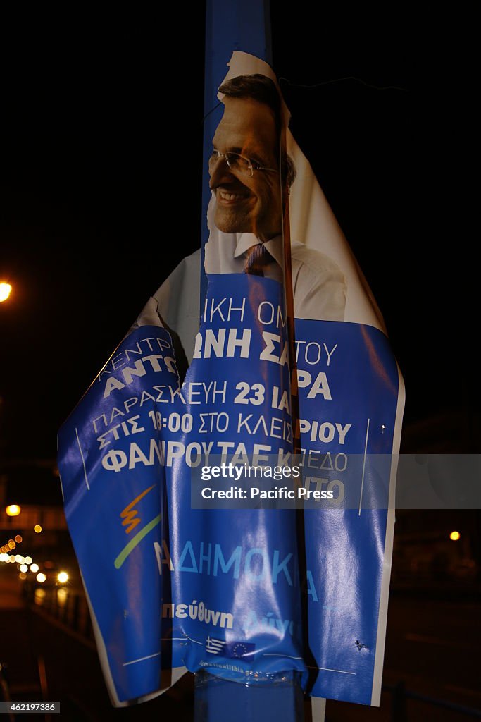 A Néa Dimokratía election poster  hanging on a lamppost...