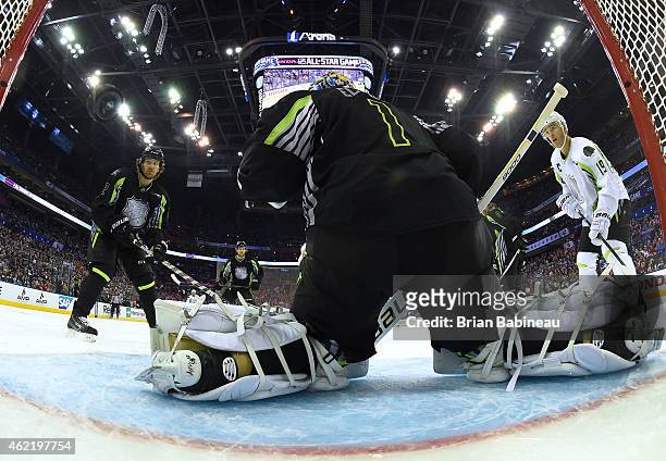 Duncan Keith of the Chicago Blackhawks and Team Foligno and Jonathan Toews of the Chicago Blackhawks and Team Toews watch the puck go into the net on...