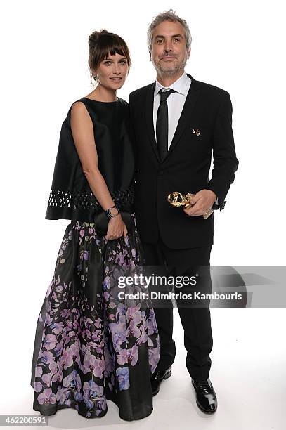 Director Alfonso Cuaron, winner of Best Director for 'Gravity,' and writer Sheherazade Goldsmith pose for a portrait during the 71st Annual Golden...