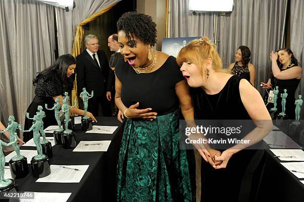 Actresses Adrienne C. Moore and Annie Golden pose in the trophy room at TNT's 21st Annual Screen Actors Guild Awards at The Shrine Auditorium on...